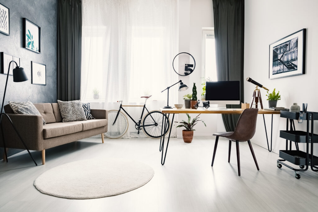 modern-home-office-interior-with-big-window-sofa-bike-de